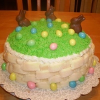 Easter Cake Easter cake made with a basket weave, chocolate bunnies and reeses eggs.