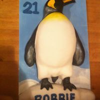 Penguin 21st birthday cake - carved chocolate cake penguin with fondant icing.