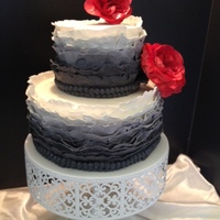 Ombre! Ruffle Cake This two-tiered cake has a total of 28 ruffles and is emblellished with two rows of fondant "beads" and topped off with two...