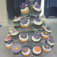 Vanilla And Chocolate Cupcakes With Vanilla Buttercream. I did 50 cupcakes all with flowers.