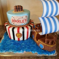 Pirate Theme Cake This is a buttercream cake with fondant accents.