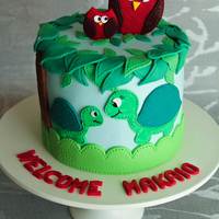 New Baby Cake Exclusively Foods chocolate mud cake layered with chocolate ganache and covered in fondant. All decorations are made from fondant including...