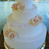 White Wedding Cake With Ivory Salmon Roses white wedding cake, with ivory-salmon roses