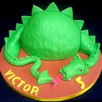 Dragon Cake Made With Sculpted Vanilla Cake Filled With Vanilla Buttercream Dragon cake made with sculpted vanilla cake filled with vanilla buttercream.