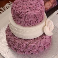 Rosette Cakes This is a shower cake I did for my cousin. It was inspired by the blurry baby photo in the background - the rosettes match the blanket she...