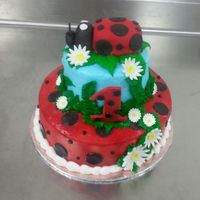 2 Tier Cake With Buttercream Icing And Fondant Accents With A Lady Bug Topper Made From Fondant And Rct 2 tier cake with buttercream icing and fondant accents with a lady bug topper made from fondant and RCT.