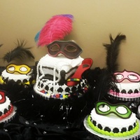 Masquerade Themed Cake And Satellites With Fondant Masks And Stiletto Masquerade themed cake and satellites with fondant masks and stiletto.