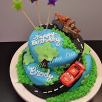 Cars (Disney/pixar) Cake Disney/Pixar Cars cake for my son. This was my very first fondant cake. The cars are matchbox cars (not edible). Fondant decorations with...