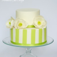 Sugar Magnolia & Fondant Striped Cake Magnolia sugar flowers and matching fondant stripesI matched the fondant stripes with the lime green of the magnolia cone.