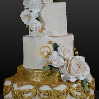 Royal Gold Made with homemade silicon molds, edible glitter, dove brush embroidery, lots of gum paste, and a ton of heart!