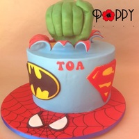 Superhero Themed Cake. I made the fist from Rice Crispy Treats, using my own fist as a reference. I think this means I have hulk hands?