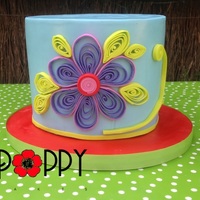 Blue Flower Cake. The cake is red velvet, covered in ganache and MFF. I have never tried quilling before, with paper or gumpaste. I learnt a lot, and made...