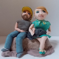 Engaged Couple With Their Dog This was created for a couple who will be getting married soon. Fondant/Gumpaste figures. The base is RKT covered in fondant.
