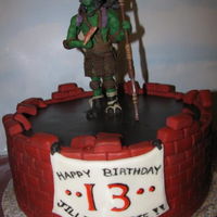 Tmnt 2014 Donatello Cake "Donnie" done in modeling chocolate...cake is lemon with white chocolate Ganache covered in fondant.