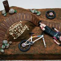 Mountain Bike Crash Birthday Cake Buttercream base and fondant details.