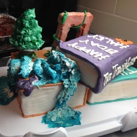 Percy Jackson fondant. tree is made of meringue circles. water is buttercream.