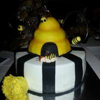 Bumble Bee Baby Shower This is a white cake with Lemon Curd filling. The Beehive is made of RC and all decorations are made of fondant.