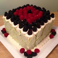 Banana, Coconut, Pineapple, Chocolate Chunk Cake With Vanilla Buttercream And Fresh Raspberries And Blackberries With A Lime Chocolate... Banana, coconut, Pineapple, chocolate chunk cake with vanilla buttercream and fresh raspberries and blackberries with a lime chocolate...