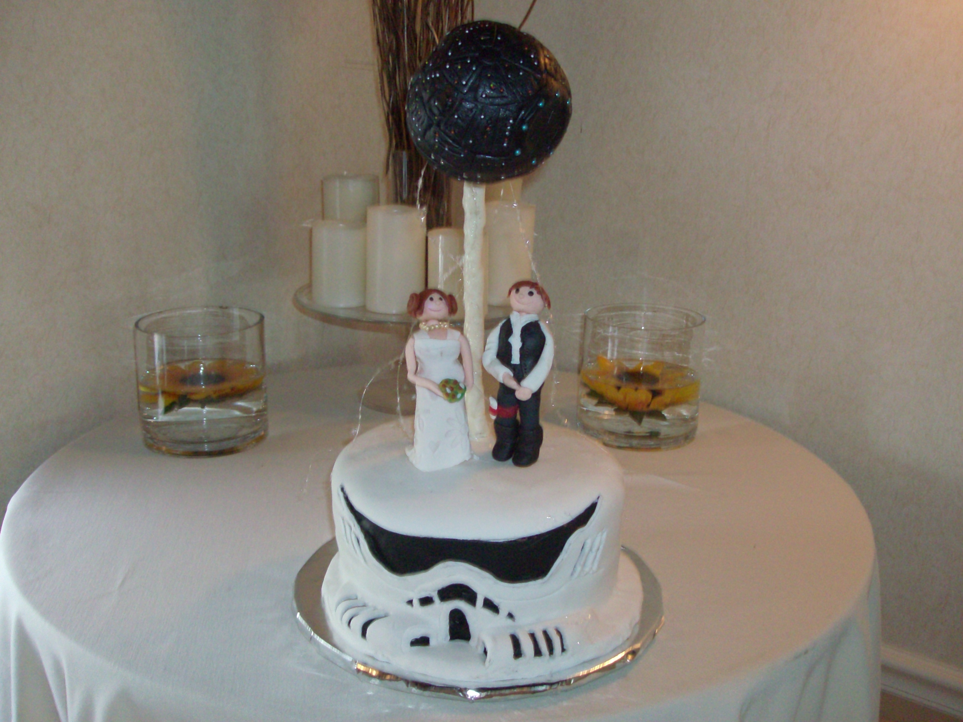 Star Wars Grooms Cake This was a groom cake for a wedding I did this past summer. Storm Trooper for the base, Bride and Groom standing on top with the Death Star...