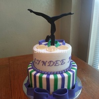 Gymnast Cake This is a butter cream cake with fondant accents. The silhouette is gum paste.
