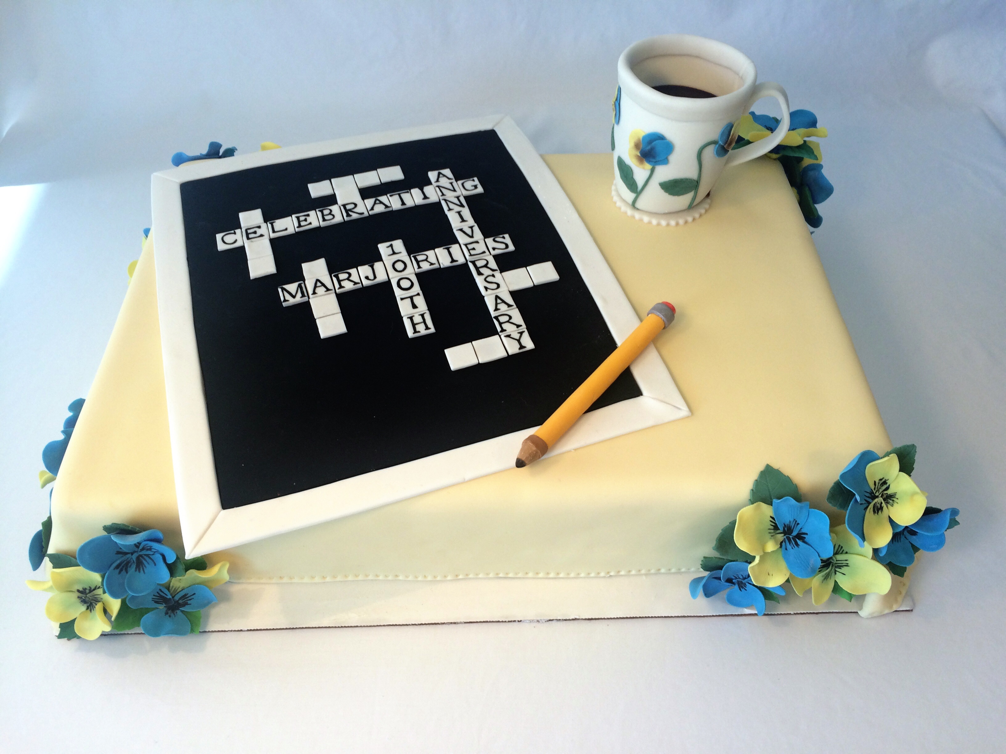 Celebration Crossword Cake I made this cake for a 100th birthday celebration. Marjorie's favourite things were crosswords, coffee, and blue and yellow pansies-...