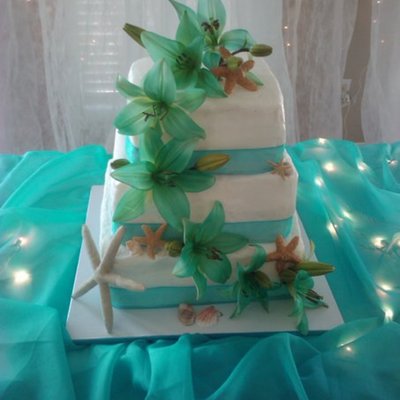 Teal Lillies & Seashells On Wedding Cake