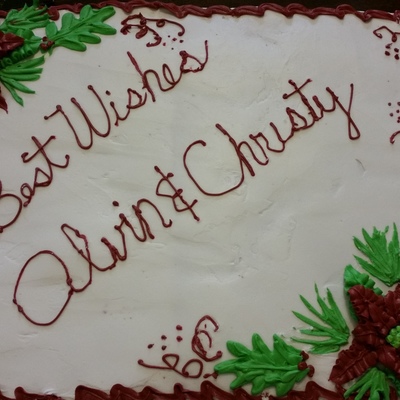 Half Chocolate And Half Vanilla Cake Done With Buttercream Poinsettias And Holly