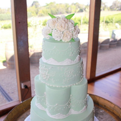 Pale Green Wedding Cake With Lace Brush Embroidery And Sugar Carnation Bouquet