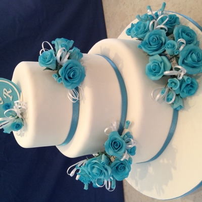 White Round Wedding Cake With Blue Flowers