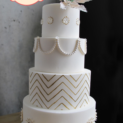 As Seen On Half Baked The Cake Blog This Has A Fantasy Flower Isomalt Gems Sugarpaste Pearls Handpainted Gold Chevrons And Sugar Broac