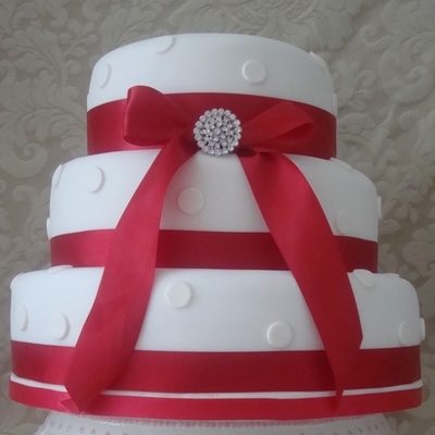 Wedding Cake With Ribbon And Brooch Arrangement