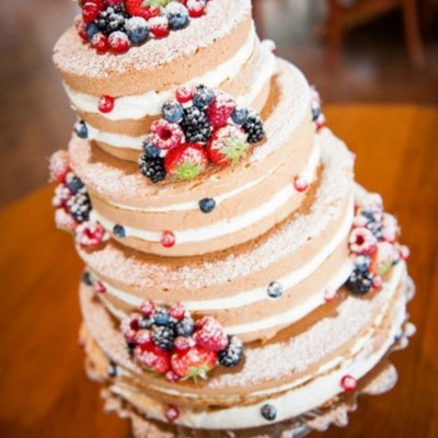 Wedding Cake With A Lot Of Fresh Fruit