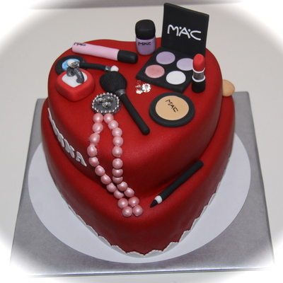 A Cake With Mac Make Up And Some Bling Bling