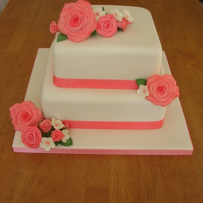 Two Tier Coral And Ivory Wedding Cake