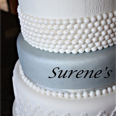 Chocolate Cake With Ganache Covered In Fondantwith Fresh Flowera Protea On Top