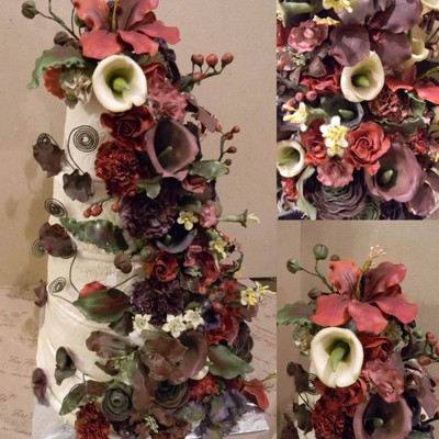 Ivory Anniv Cake With Cascading Sugar Flowers.