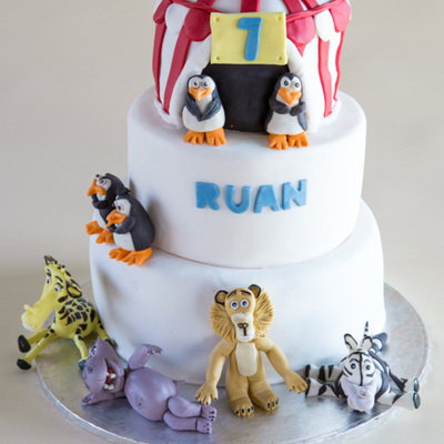 Madagascar Themed Cake For My Sons 7Th Birthday 3 Tiered Chocolate Cake With Chocolate Ganache Covered In Fondant The Middle Tier Was A