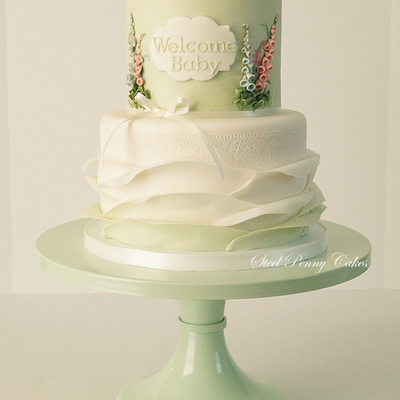 A Sweet Gender Reveal Cake With Ruffles Lace And Foxgloves
