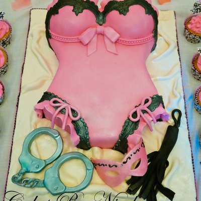 Pink And Black Bustier Corset With Whip Mask And Handcuffs For A Bachelorette Party