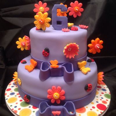 Chocolate Cake Covered With Purple Fondant Gum Paste Flowers Ladybugs And Butterflies