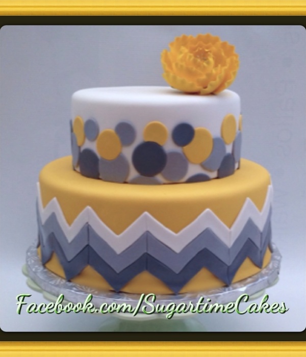Chevron Print Wedding Cake With Sporadic Circles Covered In Fondant With A Gumpaste Flower Dusted In Luster Gold Luster