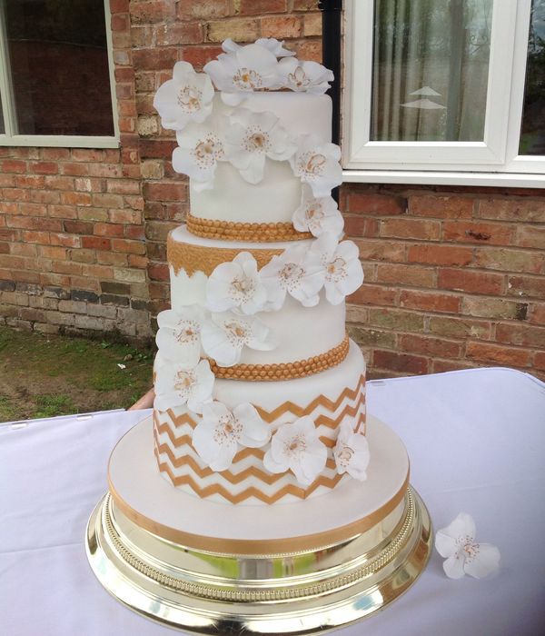 White And Gold Orchid And Chevron Weeding Cake