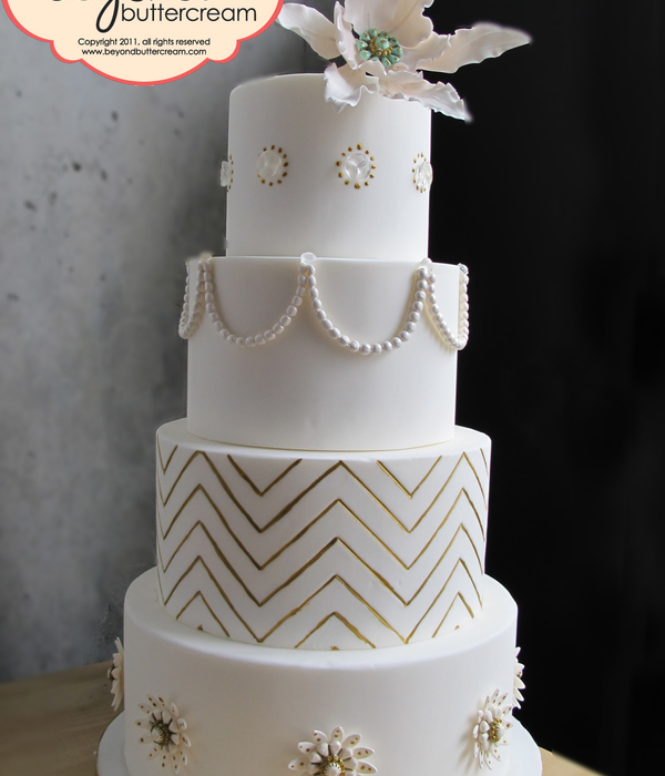 As Seen On Half Baked The Cake Blog This Has A Fantasy Flower Isomalt Gems Sugarpaste Pearls Handpainted Gold Chevrons And Sugar Broac