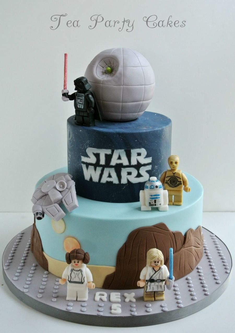 6 and 10 inch fondant covered cakes with fondant figures with hand
