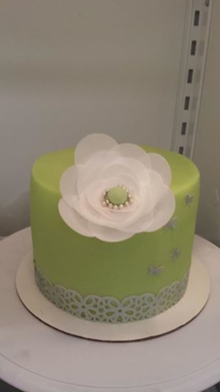 classy mint green cake with rice paper flower and border rice paper flower
