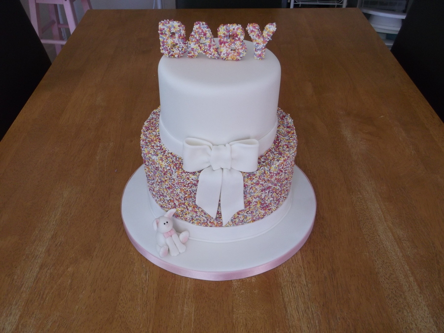 Two Tier Sprinkles Cake With Fondant Ribbon And A Little Rabbit On The