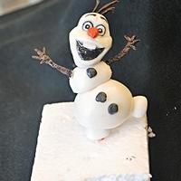 The Olaf I made this cute snowman with fondant and tylose powder.It was very fun making it...