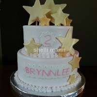 Star Cake This is a buttercream cake with fondant stars. The stars are coated with gold petal dust.
