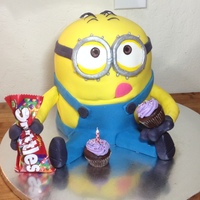 Minion Birthday Cake Chocolate cake with vanilla cream cheese frosting, decorated with a fondant/gumpaste mix.