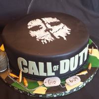 Calling All Call Of Duty Gamers!! This lucky little boy got a birthday cake fashioned after his favorite video game. The grenade is RKT covered in fondant with GP accents,...